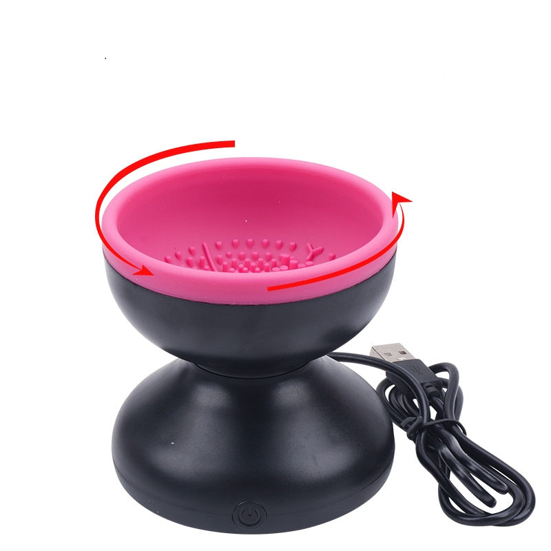 Electric makeup brush cleaner with pink inner bowl, black base, and USB cord.