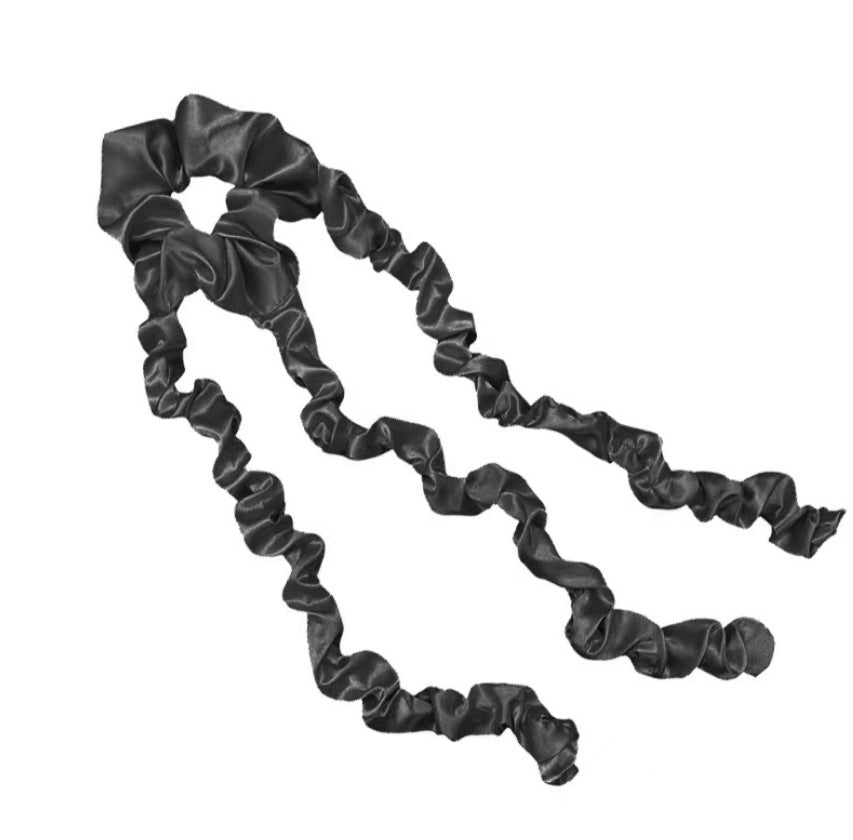Black satin heatless curling headband with ruched texture, no person shown.