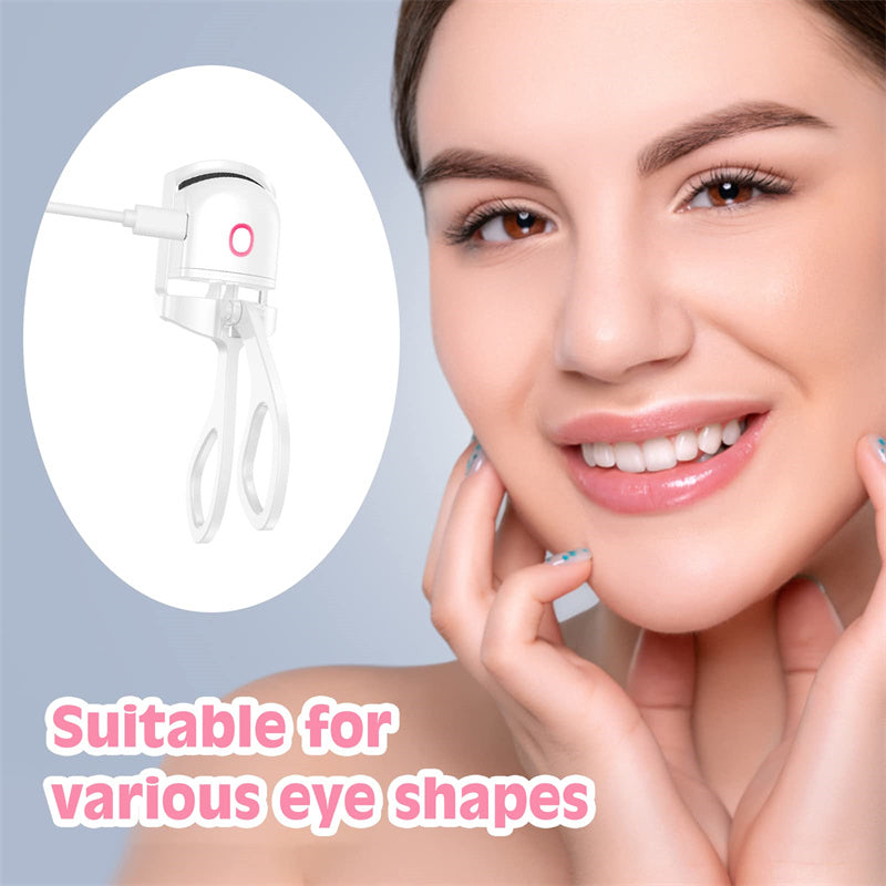 White heated eyelash curler with pink button and cord, shown near a person's face.